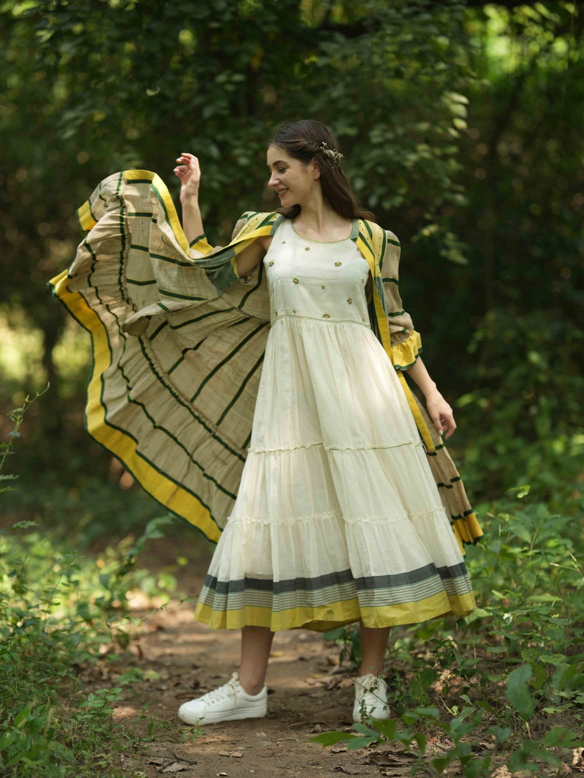 Woman in cream outfit